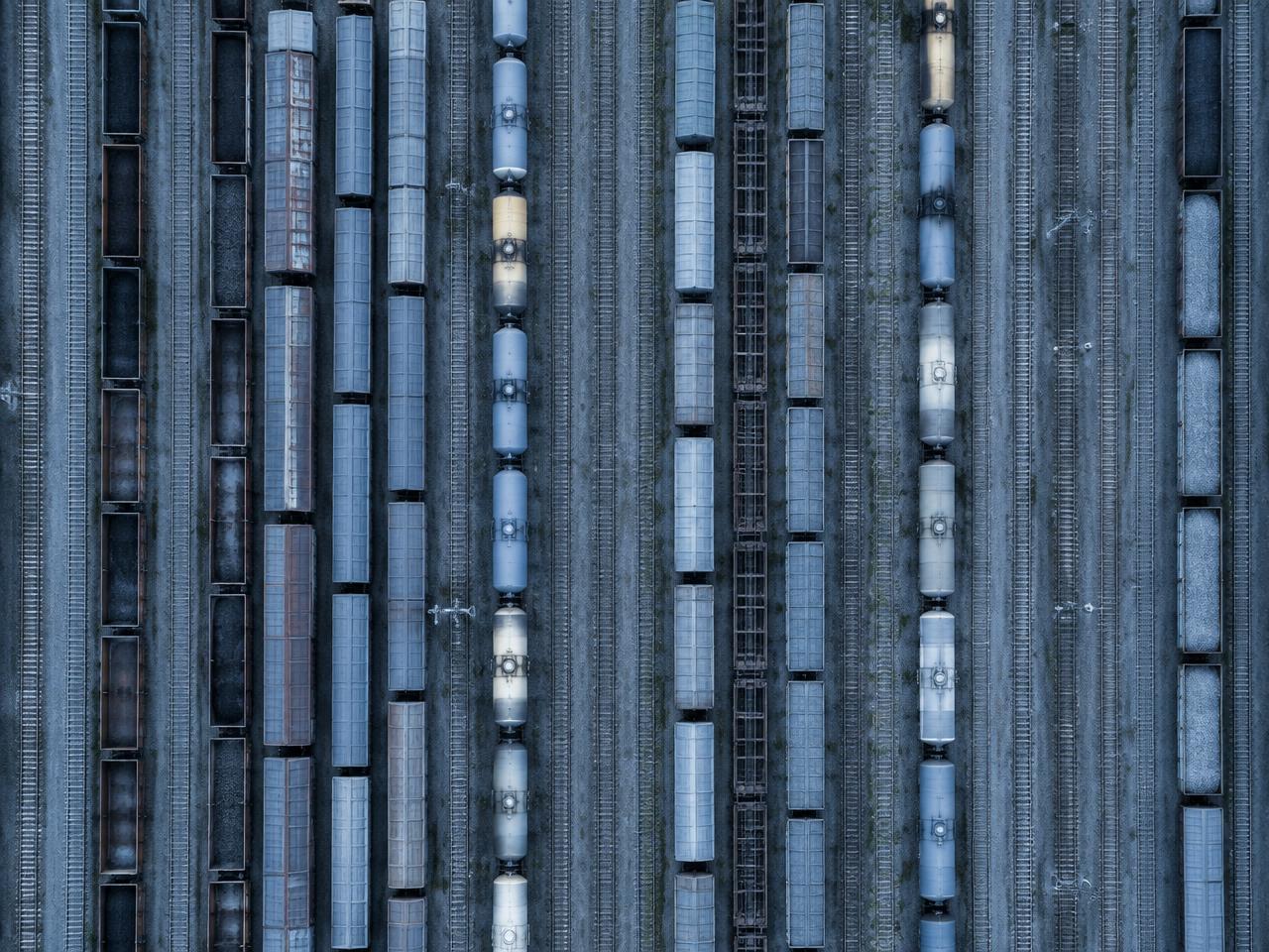 Aerial view of a marshalling yard with parallel tracks and freight wagons
